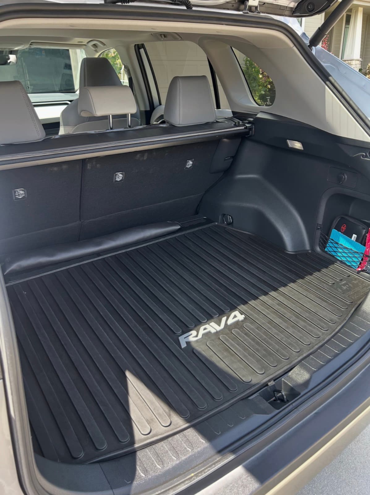 Vacuumed and wiped-down RAV4 cargo area after a full detail